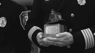 fireman holding award in his hands